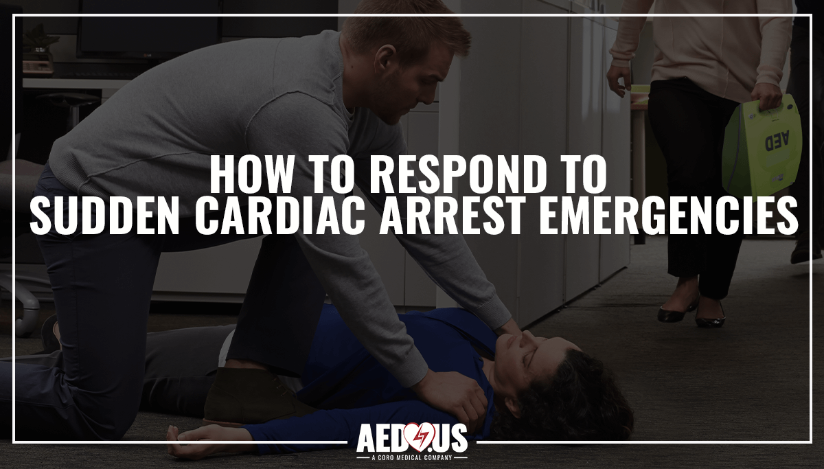 Woman laying unconscious from Sudden Cardiac Arrest and a man with his hands on her shoulders. Woman running in the background to bring an AED.