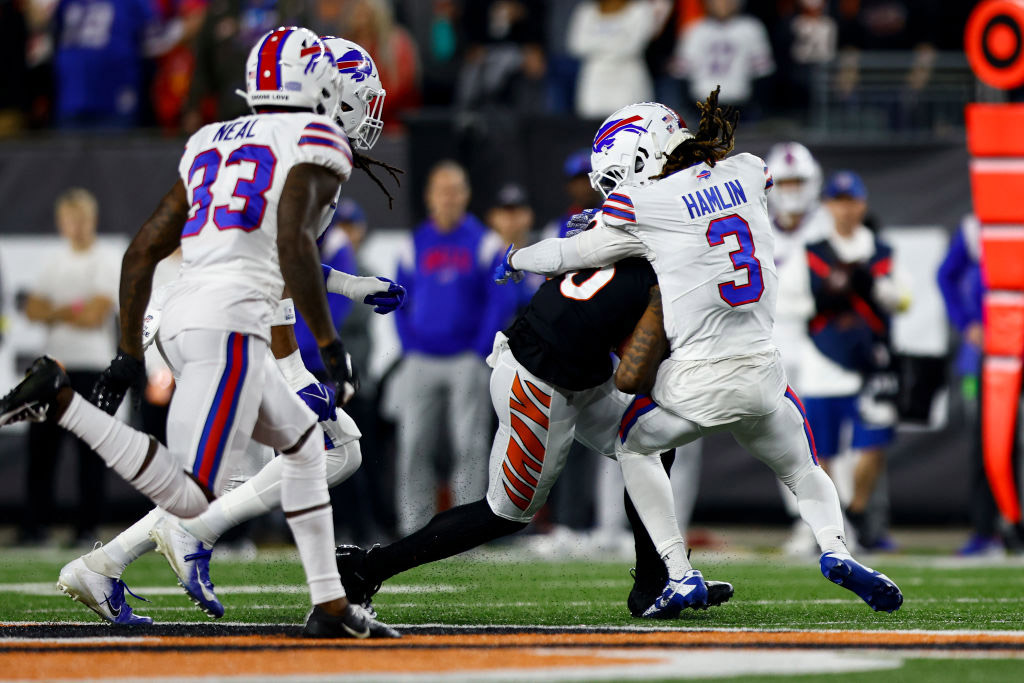 CINCINNATI, OH - JANUARY 2: Damar Hamlin #3 of the Buffalo Bills tackles Tee Higgins #85 of the Cincinnati Bengals during the first quarter of an NFL football game at Paycor Stadium on January 2, 2023 in Cincinnati, Ohio. (Photo by Kevin Sabitus/Getty Images)